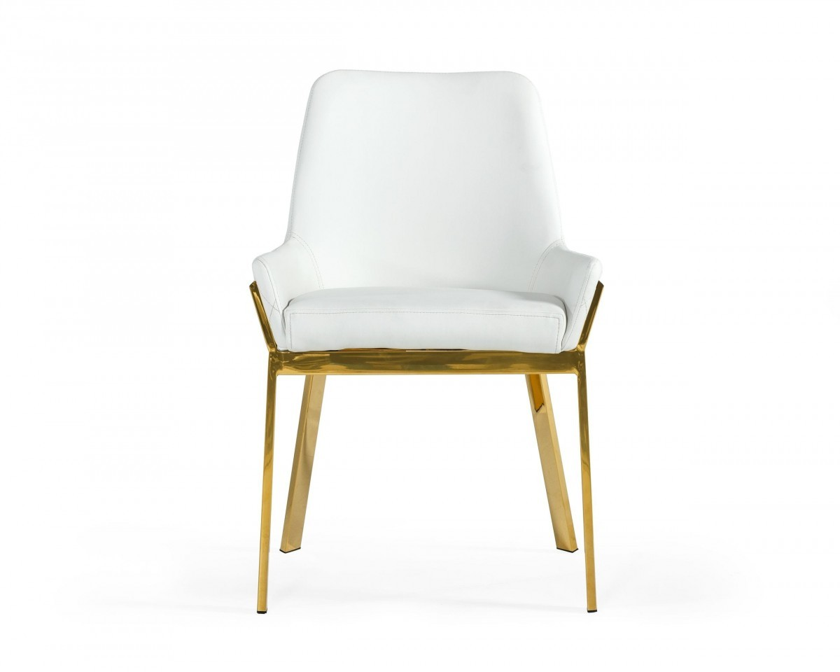 white leather chair with low arm rests on polished gold metal legs